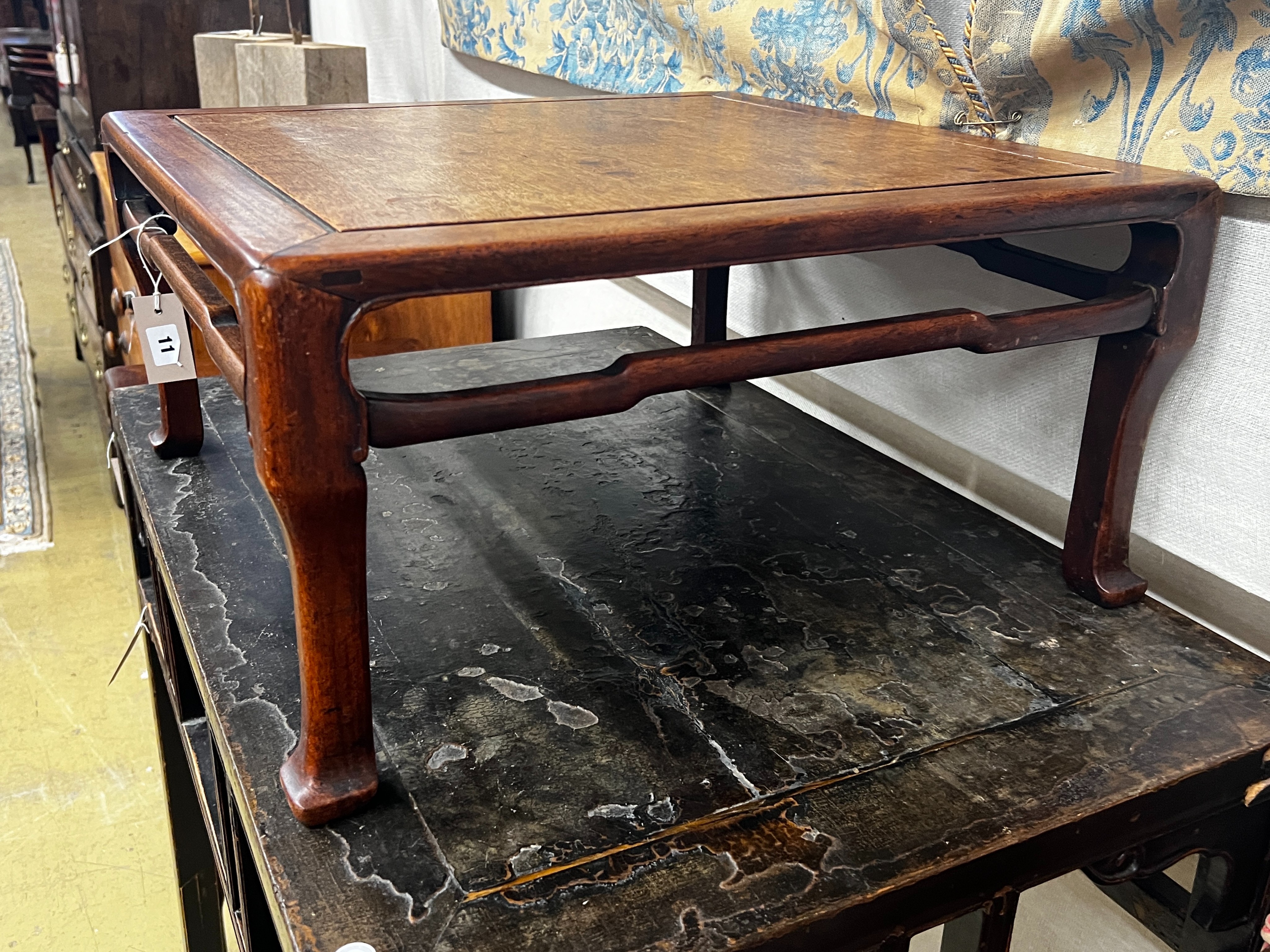 A Chinese carved hardwood square low table, width 59cm, height 29cm